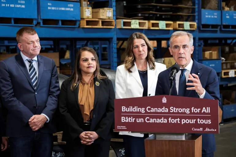 Canadian Prime Minister Mark Carney gives a speech to journalists as he announces plans regarding Alberta's proposed west coast oil pipeline, at Trans Am Piping Products, in Calgary, Alberta, Canada on July 2, 2026 [Ahmed Zakot/Reuters]