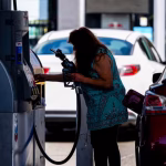 A driver refuels a vehicle with regular gasoline at a Chevron gas station in San Francisco, California, on 2 July. Photograph: David Paul Morris/Bloomberg via Getty Images